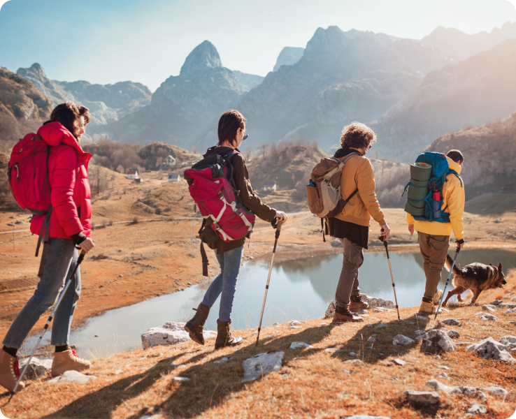 a group of people standing on top of a mountain