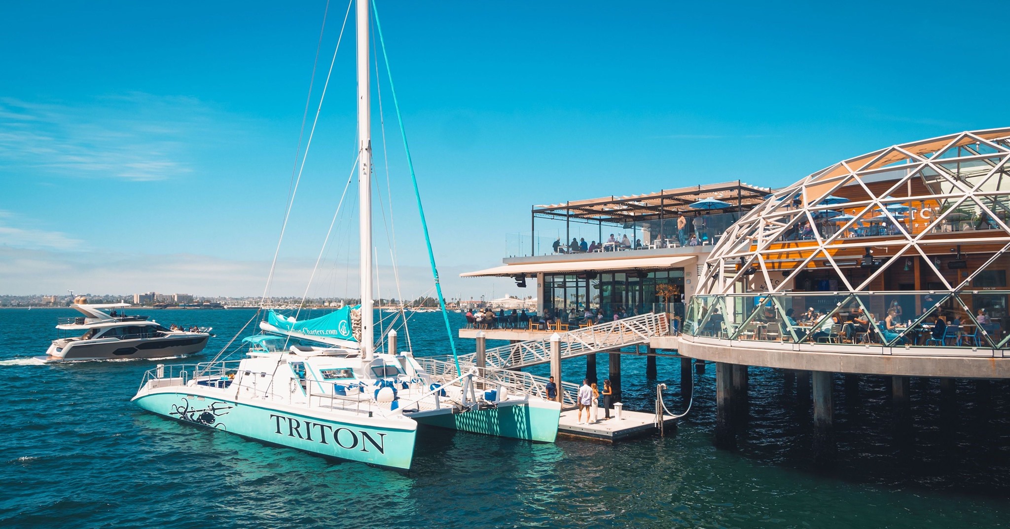 a blue boat docked in the water