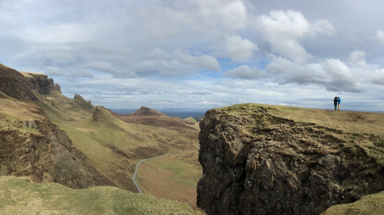 a person standing on a rocky hill