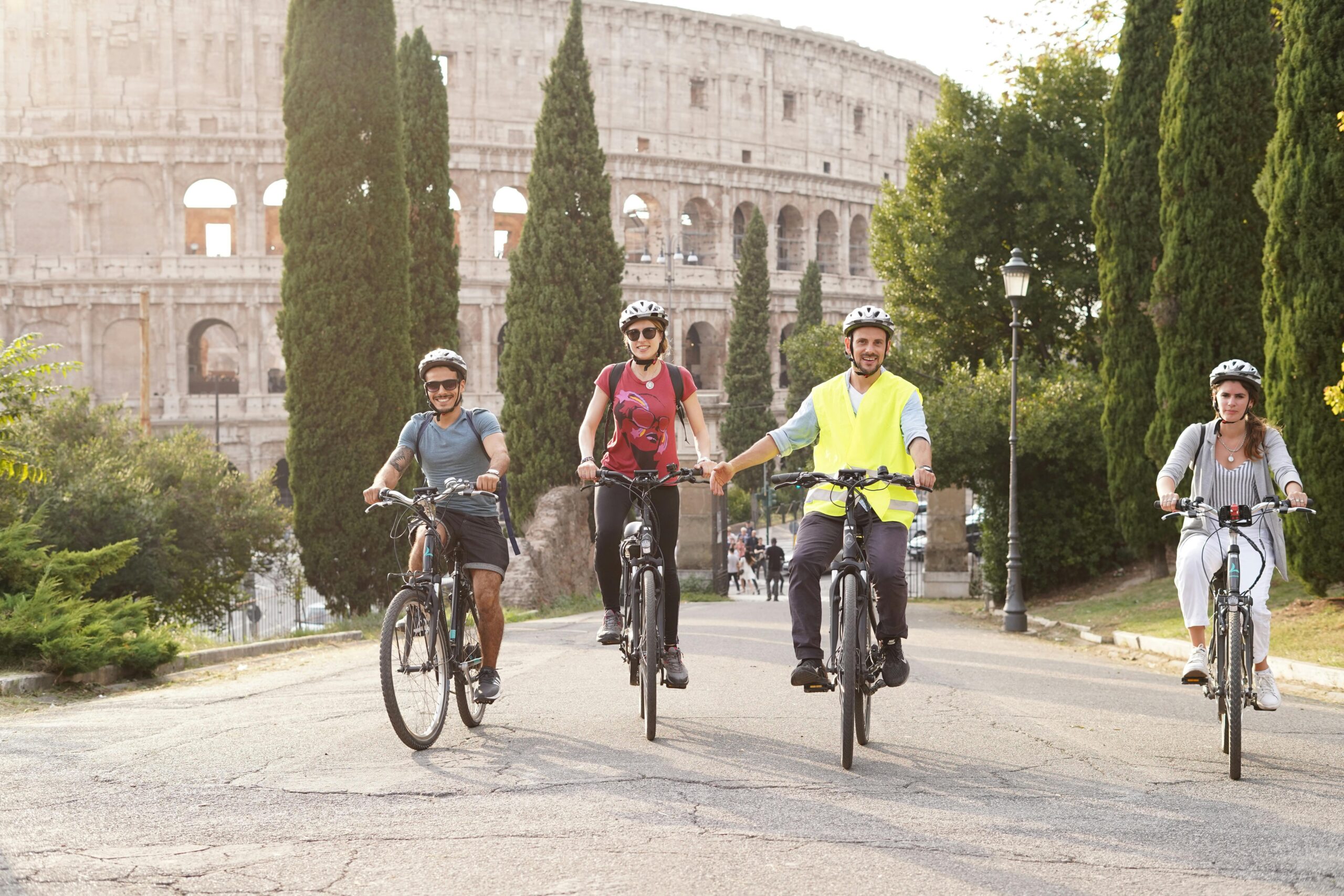 a group of people riding on the back of a bicycle